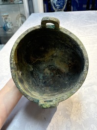 A Chinese archaic bronze food vessel with Taotie design, 'Ding 鼎', late Shang