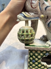 A pair of Chinese verte biscuit models of Buddhist lions, 18th C.