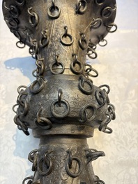 A Chinese archaistic bronze 'Zun' vase with 99 rings, 18/19th C.