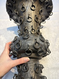 A Chinese archaistic bronze 'Zun' vase with 99 rings, 18/19th C.
