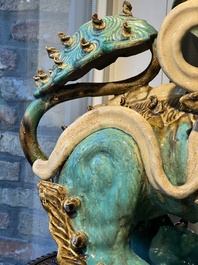 A pair of large Chinese polychrome-glazed Shiwan stoneware Buddhist lions, 19th C.