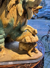 A pair of large Chinese polychrome-glazed Shiwan stoneware Buddhist lions, 19th C.