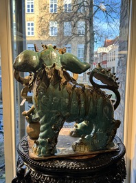 A pair of large Chinese polychrome-glazed Shiwan stoneware Buddhist lions, 19th C.