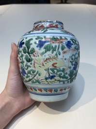 A Chinese wucai &lsquo;Buddhist Lion&rsquo; vase and cover, Transitional period