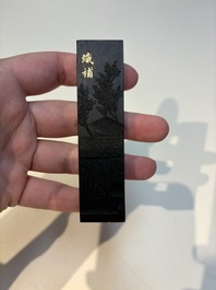 A set of eight Chinese 'Yu Zhi Min Sheng Zai Qin Shi 御製民生在勤詩' ink cakes with a gilt-lacquered 'dragon' box, Hu Kaiwen 胡開文 mark, 20th C.