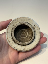 A Chinese wucai &lsquo;Buddhist Lion&rsquo; vase and cover, Transitional period