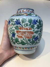 A Chinese wucai &lsquo;Buddhist Lion&rsquo; vase and cover, Transitional period