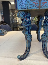 A pair of Chinese cloisonn&eacute; 'Fangding' censers and covers with Taotie design on carved wooden stands, 19th C.