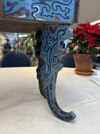 A pair of Chinese cloisonn&eacute; 'Fangding' censers and covers with Taotie design on carved wooden stands, 19th C.