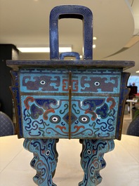 A pair of Chinese cloisonn&eacute; 'Fangding' censers and covers with Taotie design on carved wooden stands, 19th C.