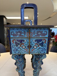 A pair of Chinese cloisonn&eacute; 'Fangding' censers and covers with Taotie design on carved wooden stands, 19th C.