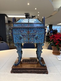 A pair of Chinese cloisonn&eacute; 'Fangding' censers and covers with Taotie design on carved wooden stands, 19th C.