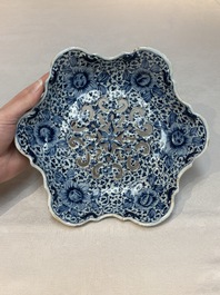 A fine blue and white Dutch Delft strawberry strainer and stand, 18th C.