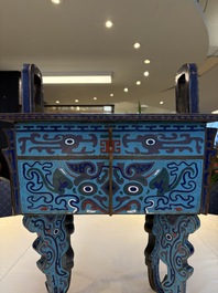 A pair of Chinese cloisonn&eacute; 'Fangding' censers and covers with Taotie design on carved wooden stands, 19th C.