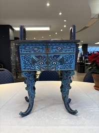 A pair of Chinese cloisonn&eacute; 'Fangding' censers and covers with Taotie design on carved wooden stands, 19th C.