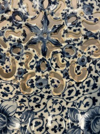 A fine blue and white Dutch Delft strawberry strainer and stand, 18th C.