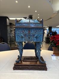 A pair of Chinese cloisonn&eacute; 'Fangding' censers and covers with Taotie design on carved wooden stands, 19th C.