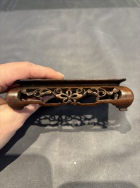 A collection of 38 Chinese wooden stands and a box, 19/20th C.