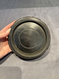 A collection of 38 Chinese wooden stands and a box, 19/20th C.