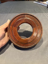 A collection of 38 Chinese wooden stands and a box, 19/20th C.