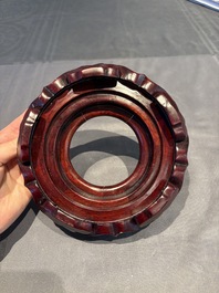 A collection of 38 Chinese wooden stands and a box, 19/20th C.