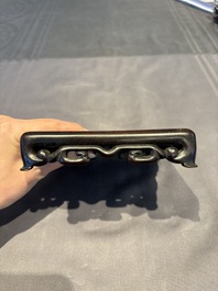 A collection of 38 Chinese wooden stands and a box, 19/20th C.