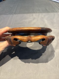 A collection of 38 Chinese wooden stands and a box, 19/20th C.