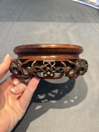 A collection of 38 Chinese wooden stands and a box, 19/20th C.