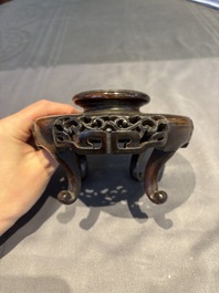 A collection of 38 Chinese wooden stands and a box, 19/20th C.