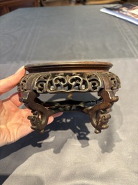 A collection of 38 Chinese wooden stands and a box, 19/20th C.