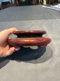 A collection of 38 Chinese wooden stands and a box, 19/20th C.