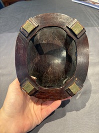 A collection of 38 Chinese wooden stands and a box, 19/20th C.