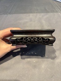 A collection of 38 Chinese wooden stands and a box, 19/20th C.