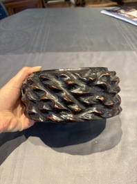 A collection of 38 Chinese wooden stands and a box, 19/20th C.