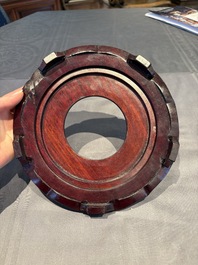 A collection of 38 Chinese wooden stands and a box, 19/20th C.