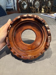 A collection of 38 Chinese wooden stands and a box, 19/20th C.