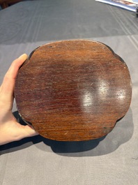 A collection of 38 Chinese wooden stands and a box, 19/20th C.