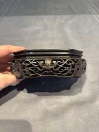 A collection of 38 Chinese wooden stands and a box, 19/20th C.