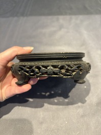 A collection of 38 Chinese wooden stands and a box, 19/20th C.