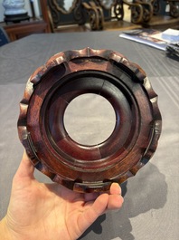 A collection of 38 Chinese wooden stands and a box, 19/20th C.