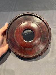 A collection of 38 Chinese wooden stands and a box, 19/20th C.