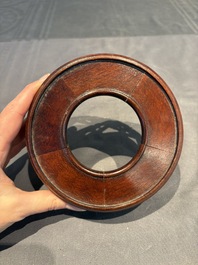 A collection of 38 Chinese wooden stands and a box, 19/20th C.