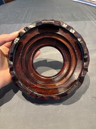 A collection of 38 Chinese wooden stands and a box, 19/20th C.