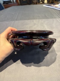 A collection of 38 Chinese wooden stands and a box, 19/20th C.