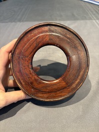 A collection of 38 Chinese wooden stands and a box, 19/20th C.