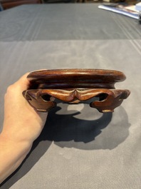 A collection of 38 Chinese wooden stands and a box, 19/20th C.