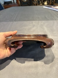 A collection of 38 Chinese wooden stands and a box, 19/20th C.