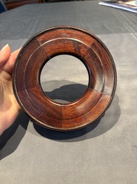 A collection of 38 Chinese wooden stands and a box, 19/20th C.