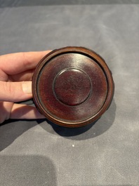 A collection of 38 Chinese wooden stands and a box, 19/20th C.