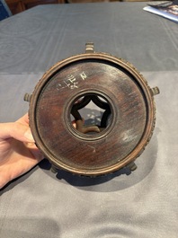 A collection of 38 Chinese wooden stands and a box, 19/20th C.